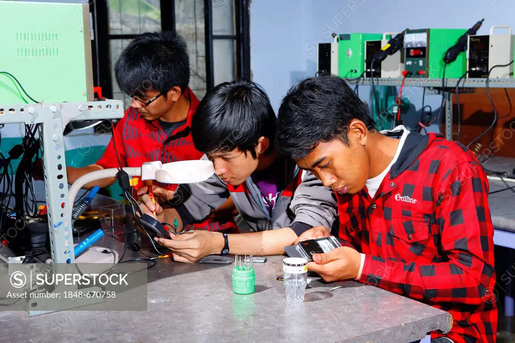 Teenagers being trained as electrical engineers, Sukabumi, Bandung, Java, Indonesia, Southeast Asia