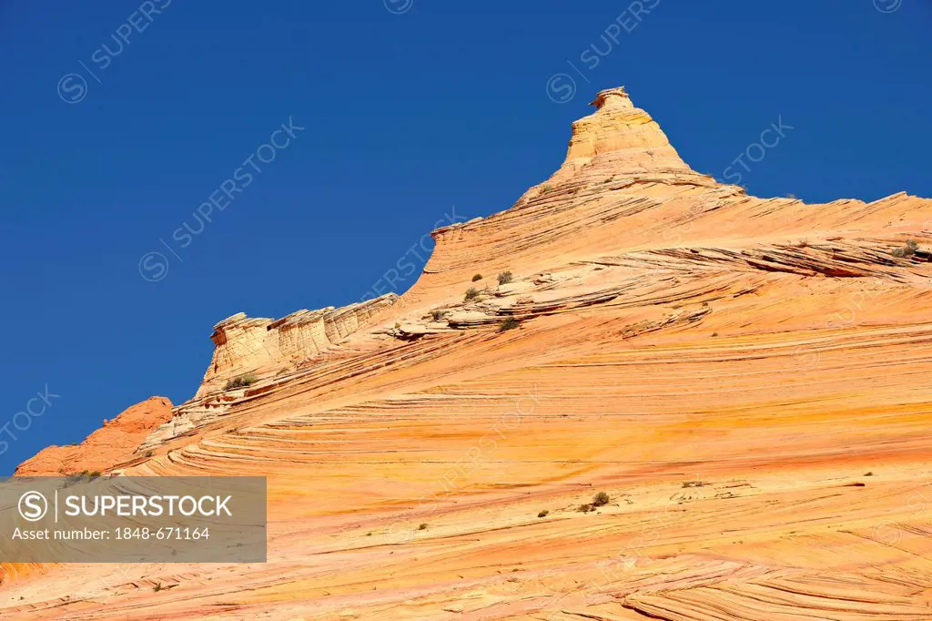 The Sentinel rock formation on the way to The Wave sandstone formation, North Coyote Buttes, Paria Canyon, Vermillion Cliffs National Monument, Arizon...