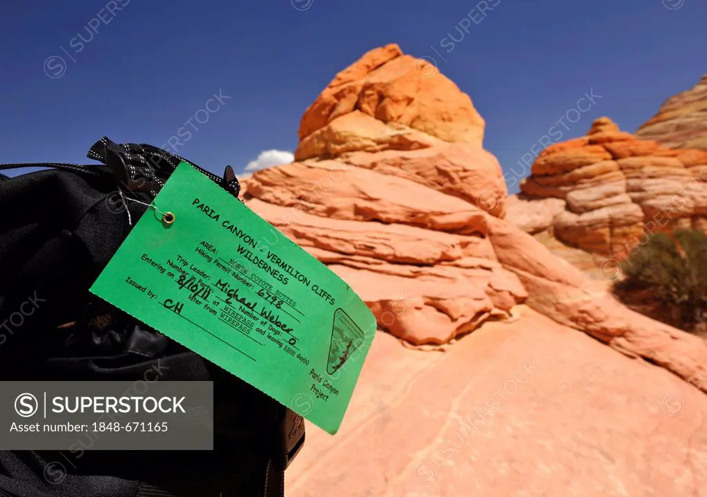 Coveted permit, attached to backpack, for the hike to The Wave sandstone formation, North Coyote Buttes, Paria Canyon, Vermillion Cliffs National Monu...