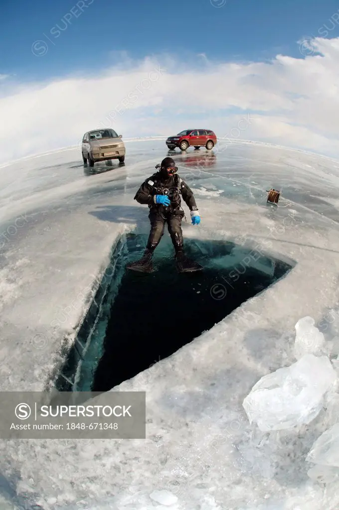 Diver, ice-diving, in Lake Baikal, Olkhon island, Siberia, Russia, Eurasia