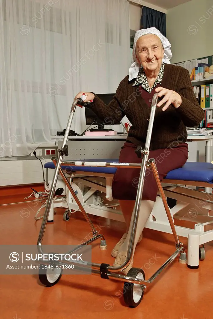 Old woman with a wheeled walker