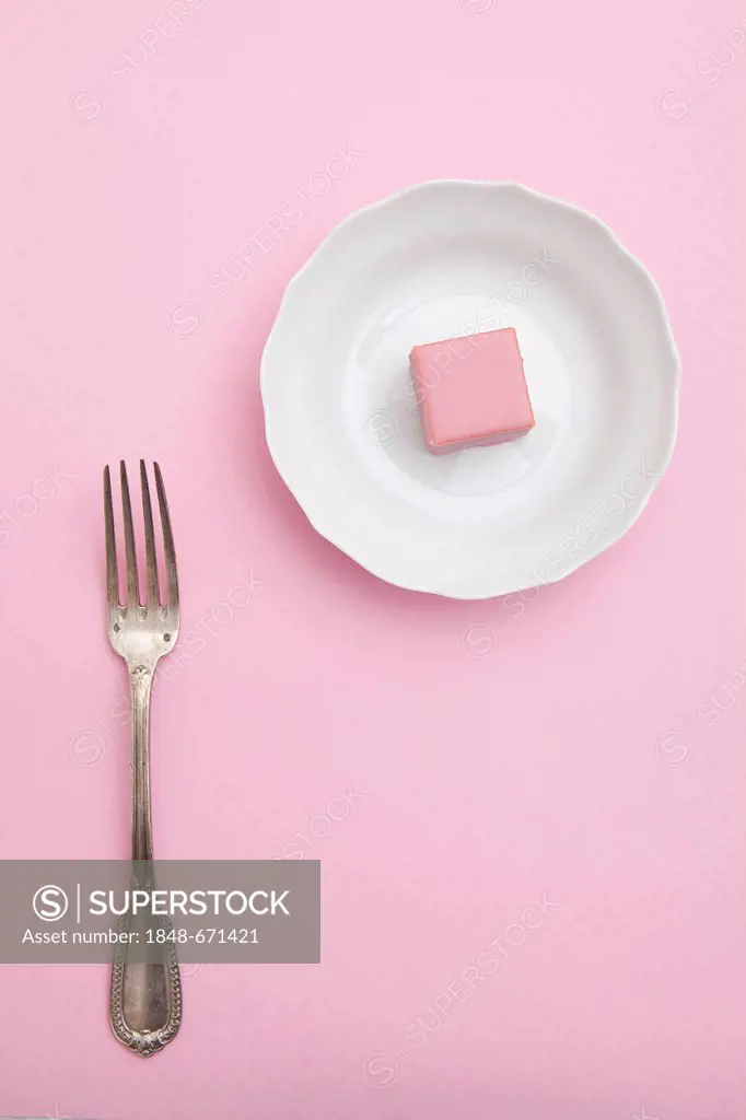 Pink chocolate on a plate, fork, dessert