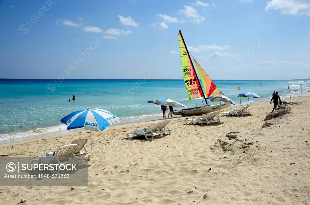 Sailing boat, sunshades on the beach, Santa Maria del Mar, Playas del Este, Havana, Habana, Cuba, Greater Antilles, Gulf of Mexico, Caribbean, Central...
