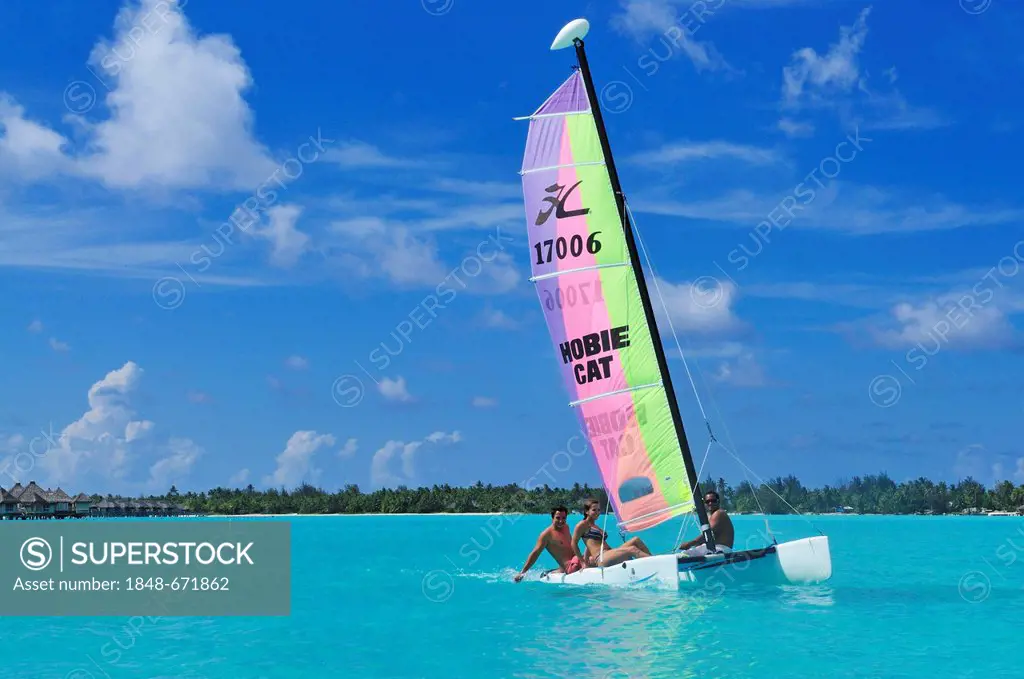 Tourists on a catamaran, St. Regis Bora Bora Resort, Bora Bora, Leeward Islands, Society Islands, French Polynesia, Pacific Ocean