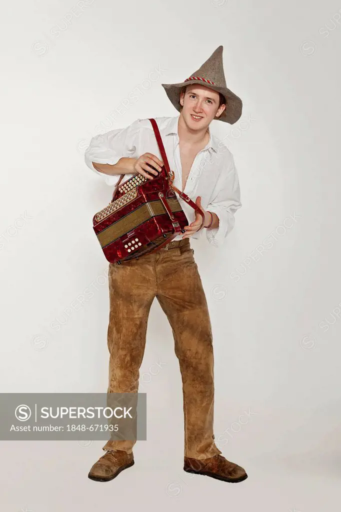 Musician wearing a traditional costume playing accordion, Austria