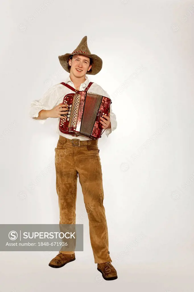 Musician wearing a traditional costume playing accordion, Austria