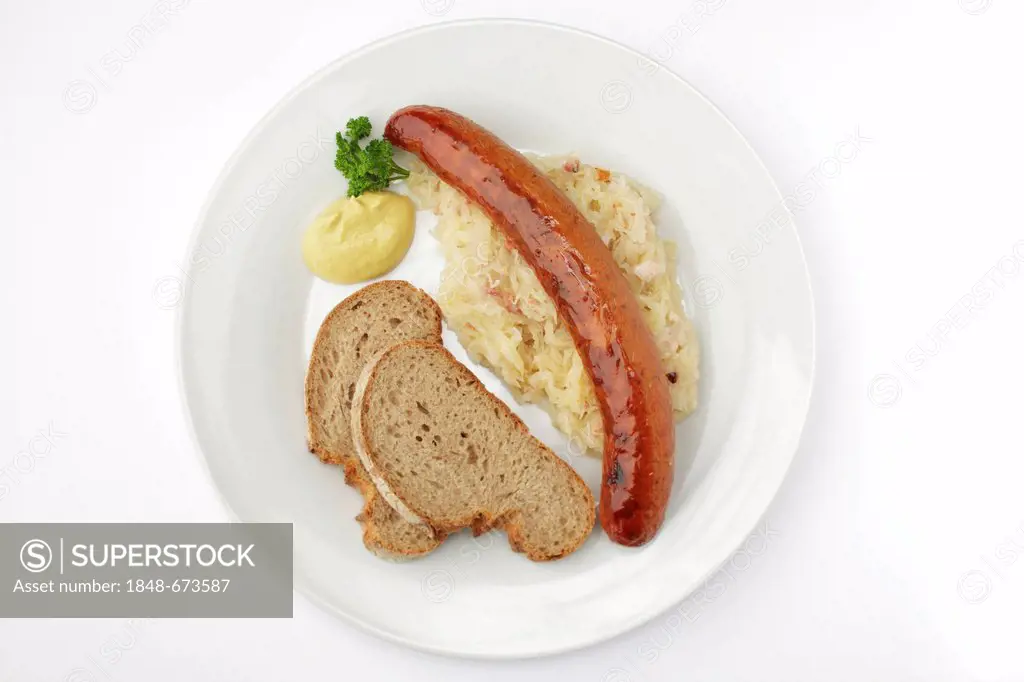 Krakowska smoked spicy Polish sausage on sauerkraut, crusty bread and mustard