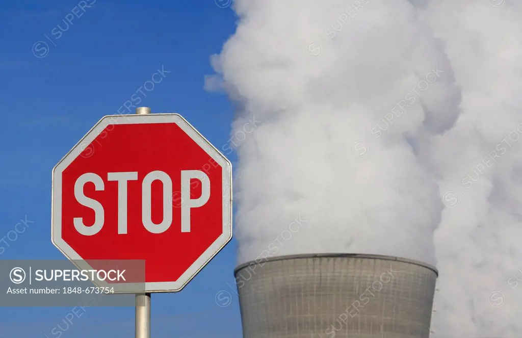 Symbolic image against nuclear power, stop sign in front of a cooling tower of the Gundremmingen nuclear power plant, Bavaria, Germany, Europe