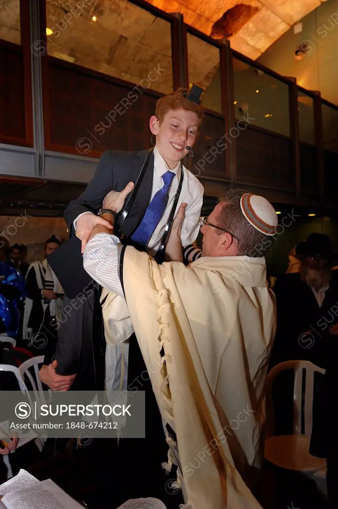 Bar Mitzvah, Jewish coming of age ritual, at the end of the ceremony, youth is lifted up and carried around the Torah table, Western Wall or Wailing W...