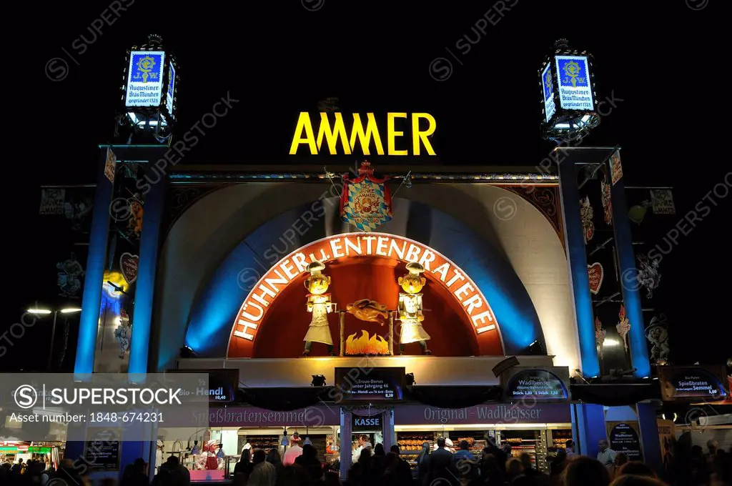 Brightly illuminated Ammer Huehner- und Entenbraterei, chicken and duck roasters, festival tent at night, Oktoberfest 2010, Munich, Upper Bavaria, Bav...