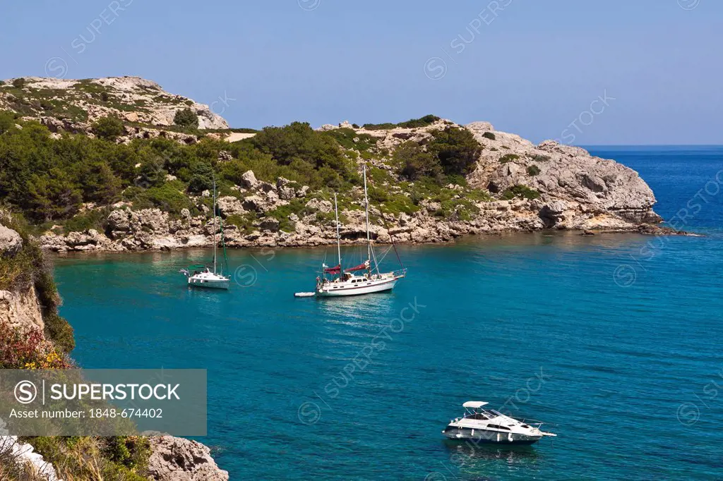 Sailing ships in Ladiko Bay, near Faliraki, Rhodes, Greece, Europe