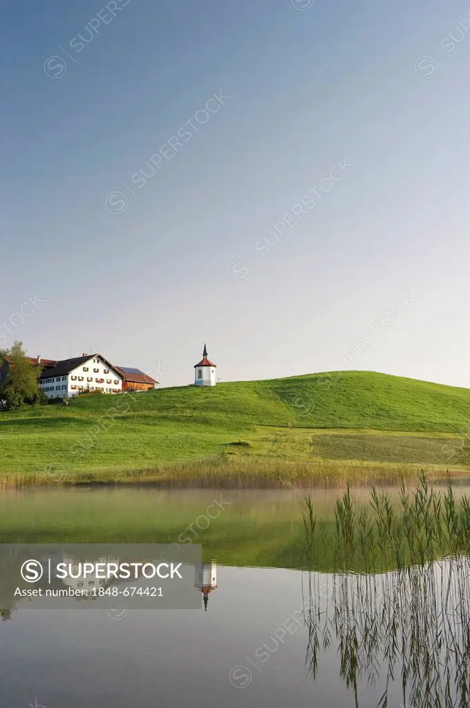 Hegratsrieder Kapelle chapel and lake Hegratsrieder See near Fuessen, Allgaeu region, Bavaria, Germany, Europe