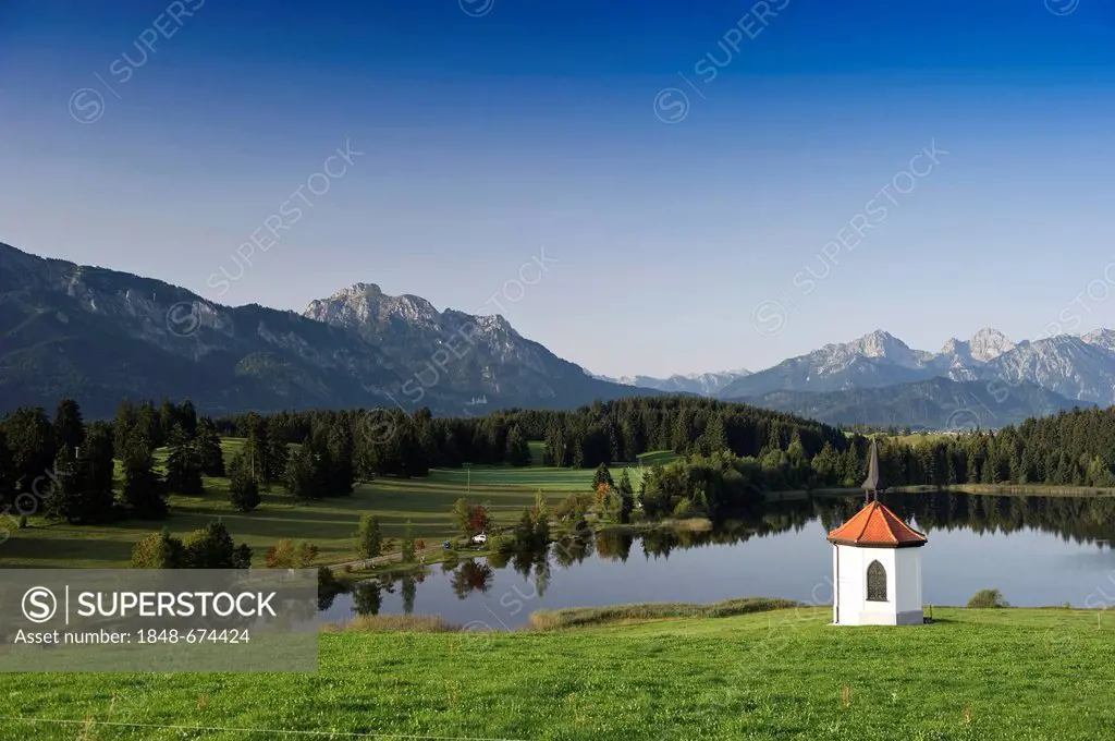 Hegratsrieder Kapelle chapel and lake Hegratsrieder See near Fuessen, Allgaeu region, Bavaria, Germany, Europe
