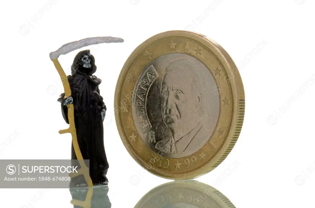 Death is standing next to a Spanish euro coin, symbolic image for the crisis of the euro