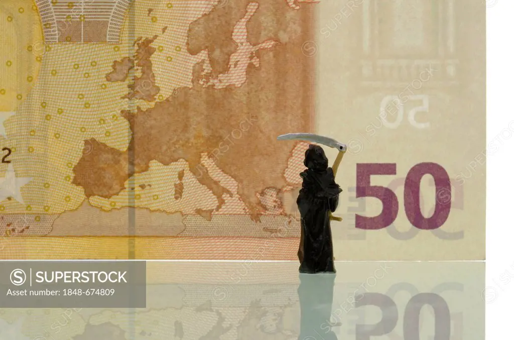 Death is looking at a map of Europe on a 50 euro note, symbolic image for the crisis of the euro