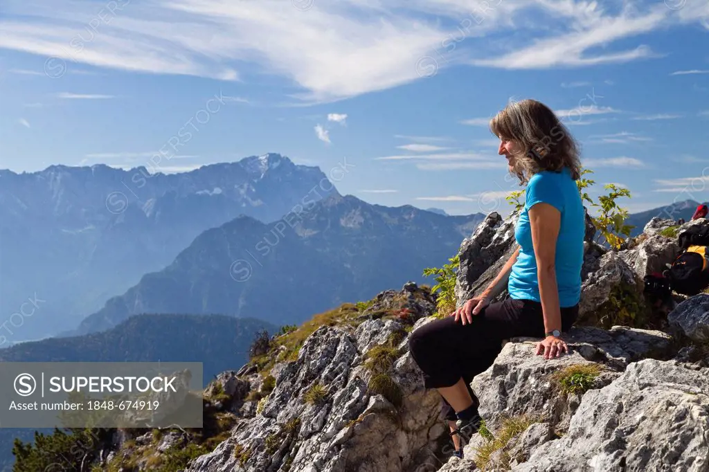 Woman, 45, on Ettaler Manndl Mountain, a sub-peak of Laberberg Mountain in the Ammergau Alps, looking towards Zugspitze Mountain, Ettal, Upper Bavaria...
