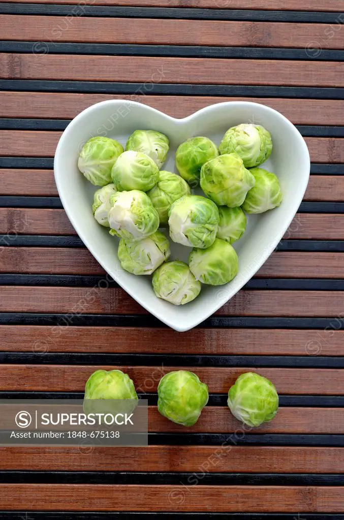 Brussels sprouts in a heart-shaped porcelain bowl