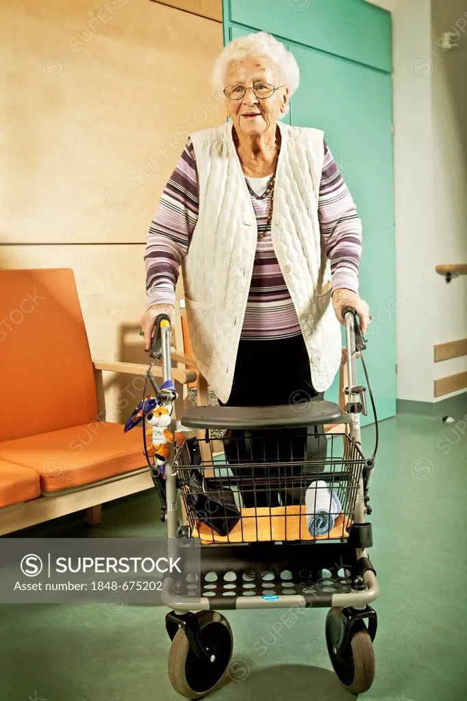 Elderly woman using a walker