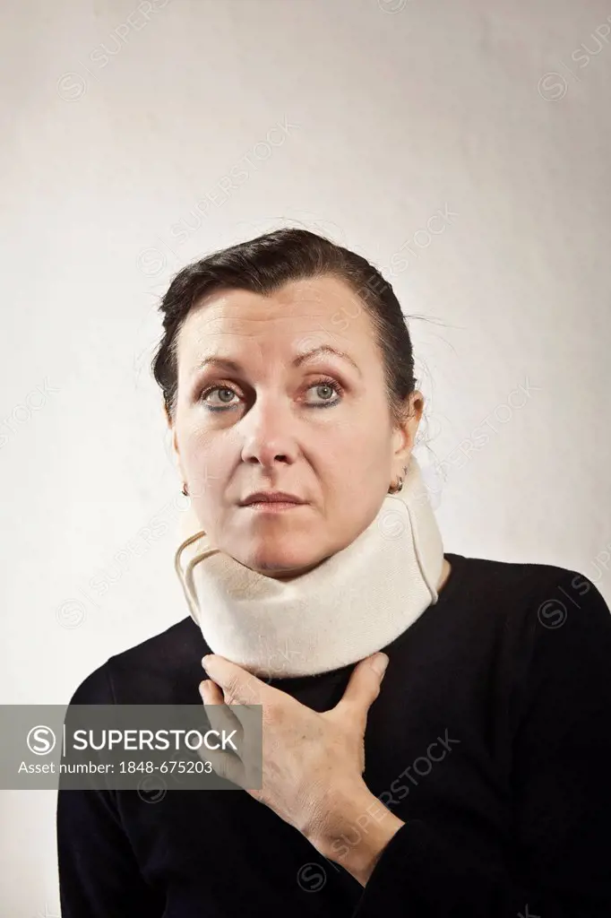 Woman wearing a cervical collar, whiplash
