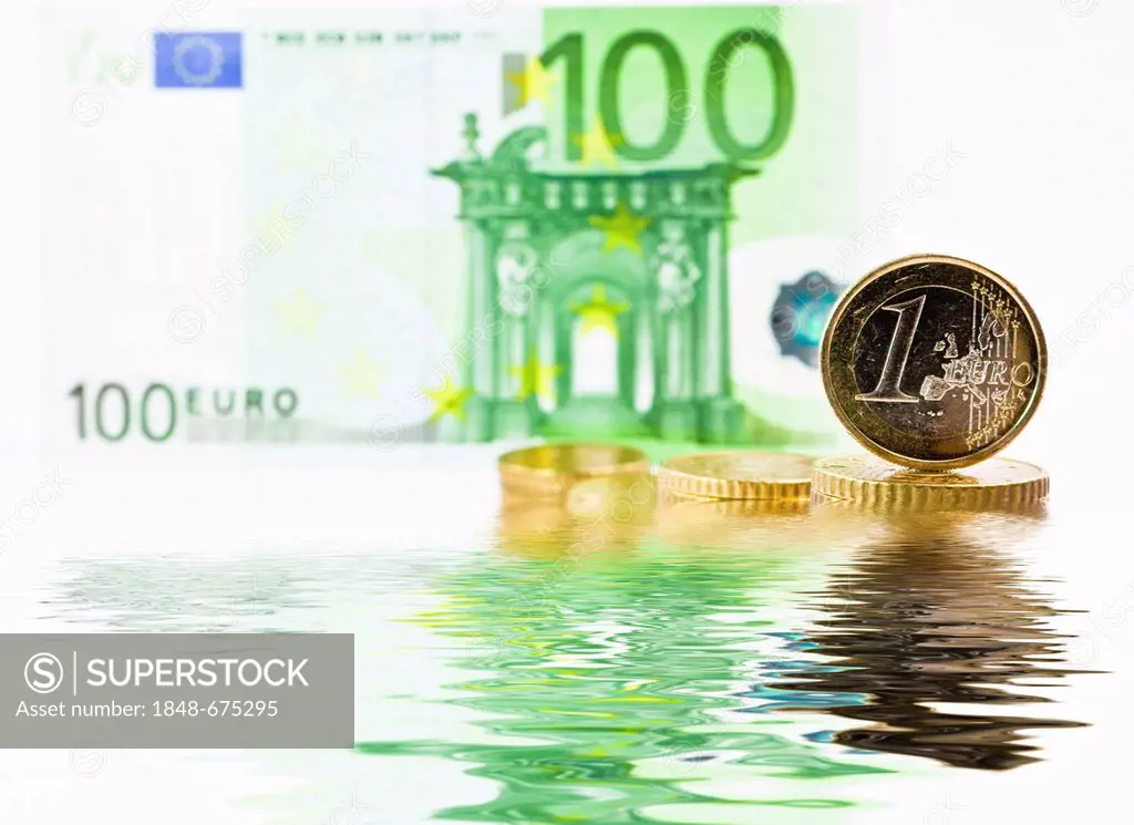 Euro note and euro coin, water, symbolic image for the dilution of the euro, decline in the value of the euro, depreciation of the euro, sinking of th...