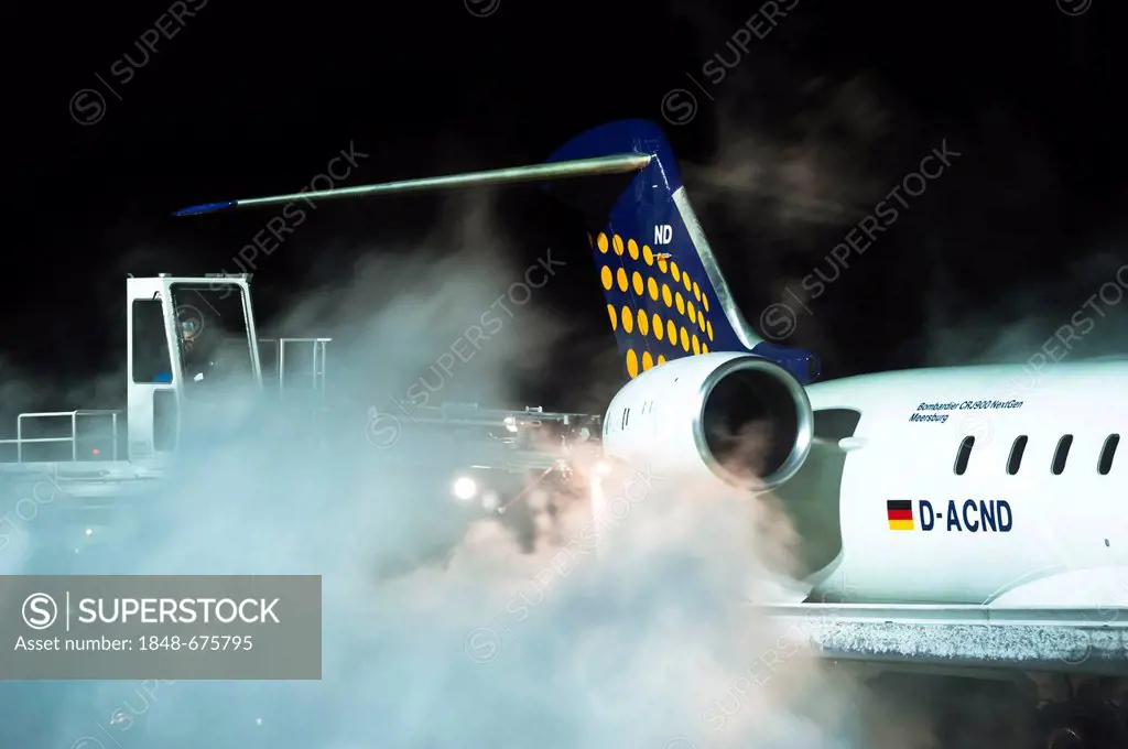 Lufthansa aircraft, Bombardier, being de-iced, Tegel Airport, Berlin, Germany, Europe