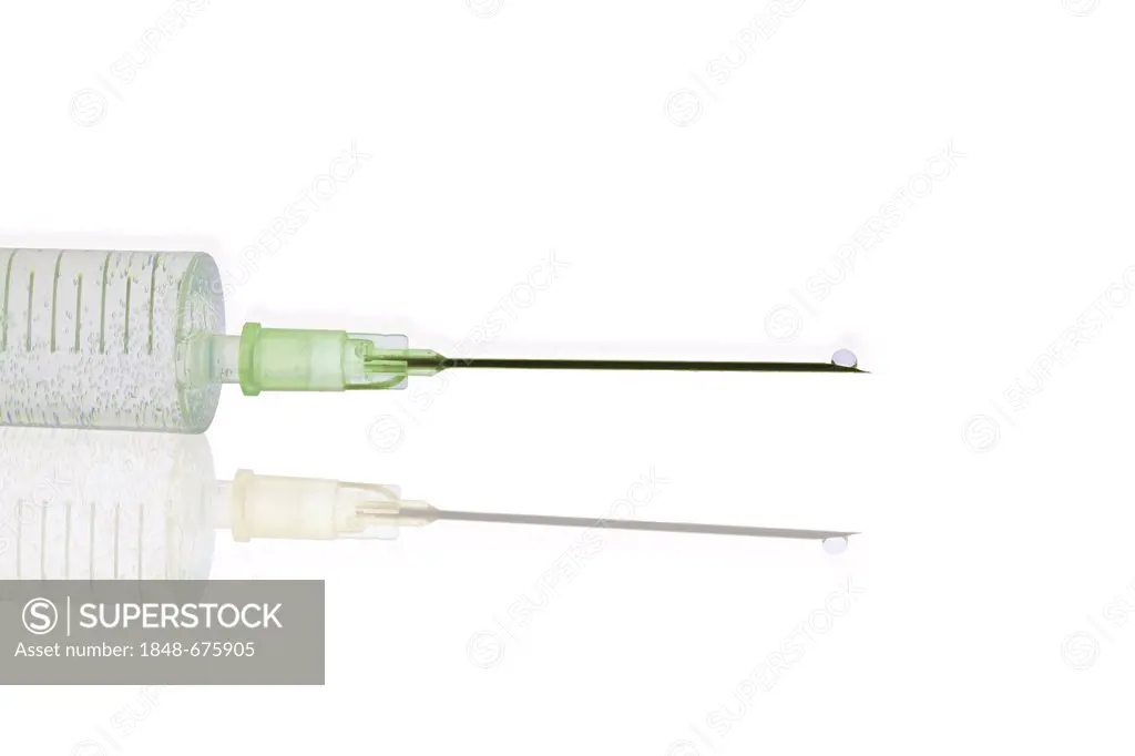 Syringe with a hypodermic needle and a droplet