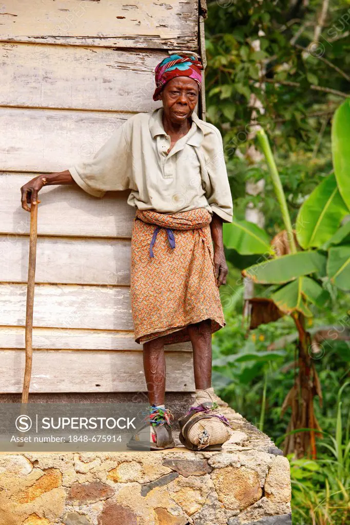Leprous woman outside her house, tuberculosis and leprosy station, Manyemen, Cameroon, Africa