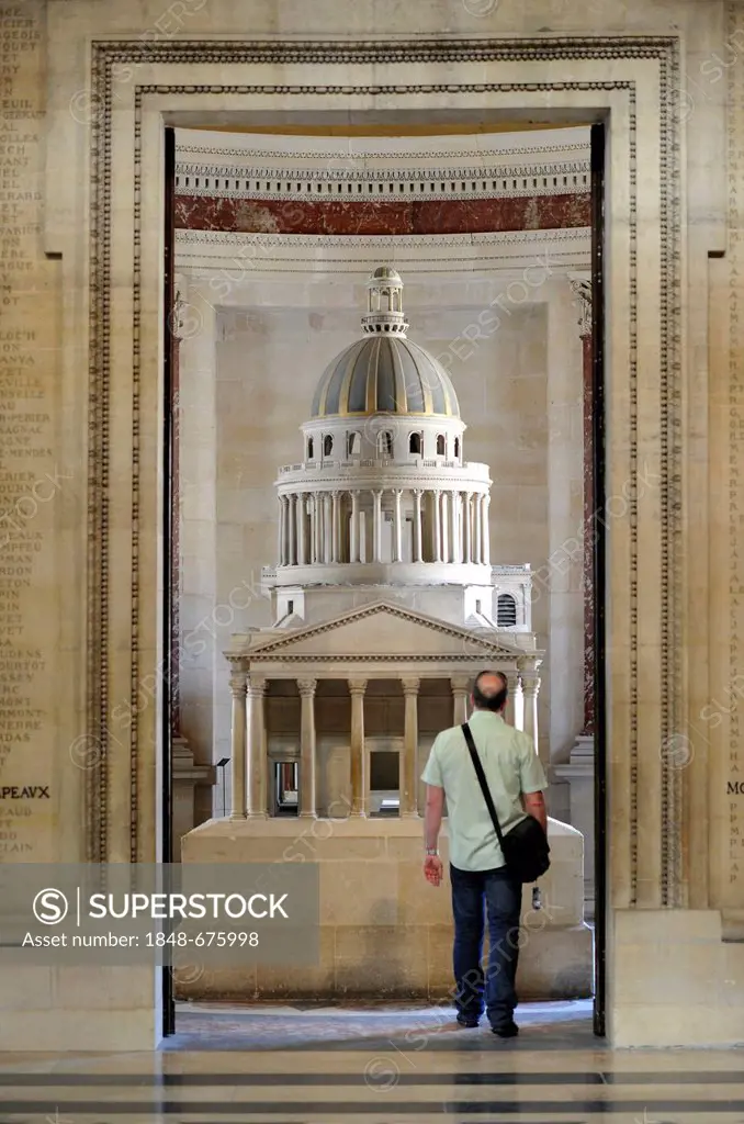 Tourist standing in front of a model, Panthéon, a mausoleum for French National heroes, Montagne Sainte-Geneviève, Hill of St. Genevieve, Paris, Franc...