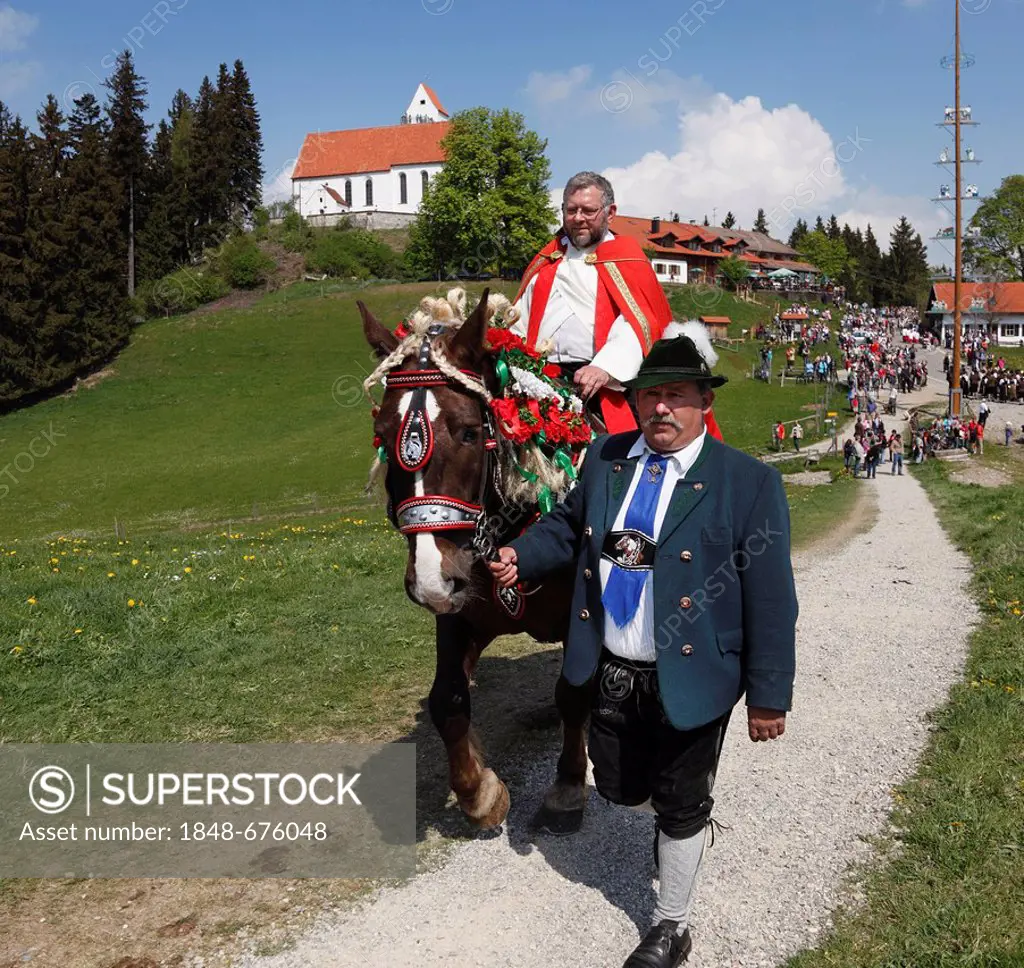 Pastor riding on horseback, St. George's Ride horse pilgrimage, Auerberg, Bernbeuren, Allgaeu, Upper Bavaria, Bavaria, Germany, Europe