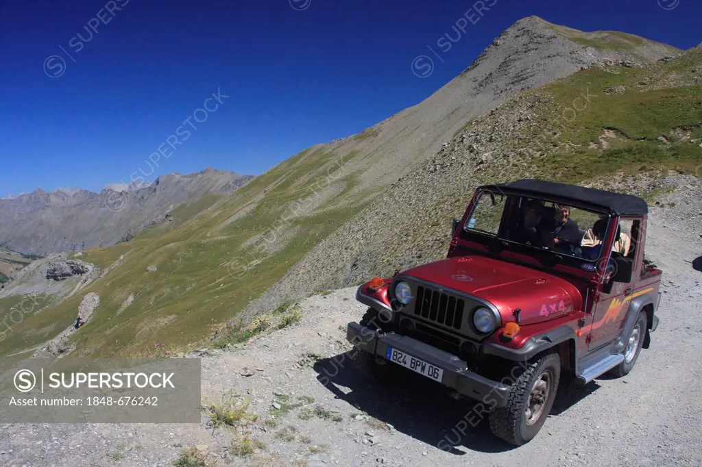 Off-road vehicle driving on the road to the Col de la Bonette mountain pass, highest paved road in Europe, Alpes-Maritimes department, Western Alps, F...