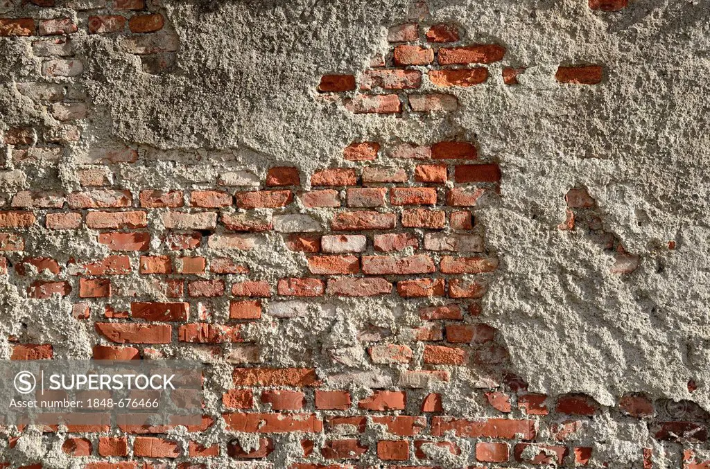 Brickwork of so-called Reichsformat or German format bricks with plaster peeling, Miesbach, Upper Bavaria, Bavaria, Germany, Europe