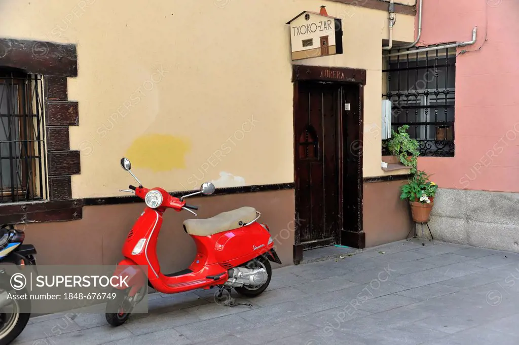Vespa scooter, house entrance, old town, Madrid, Spain, Europe