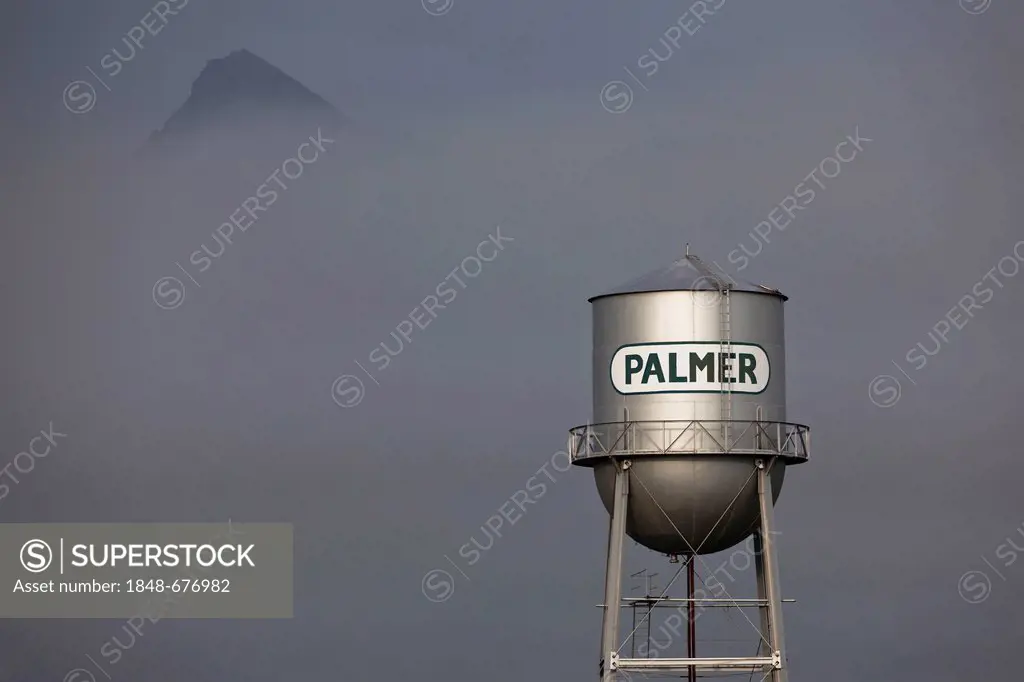 Water tank with fog and the mountains of Palmer, Alaska, USA, PublicGround