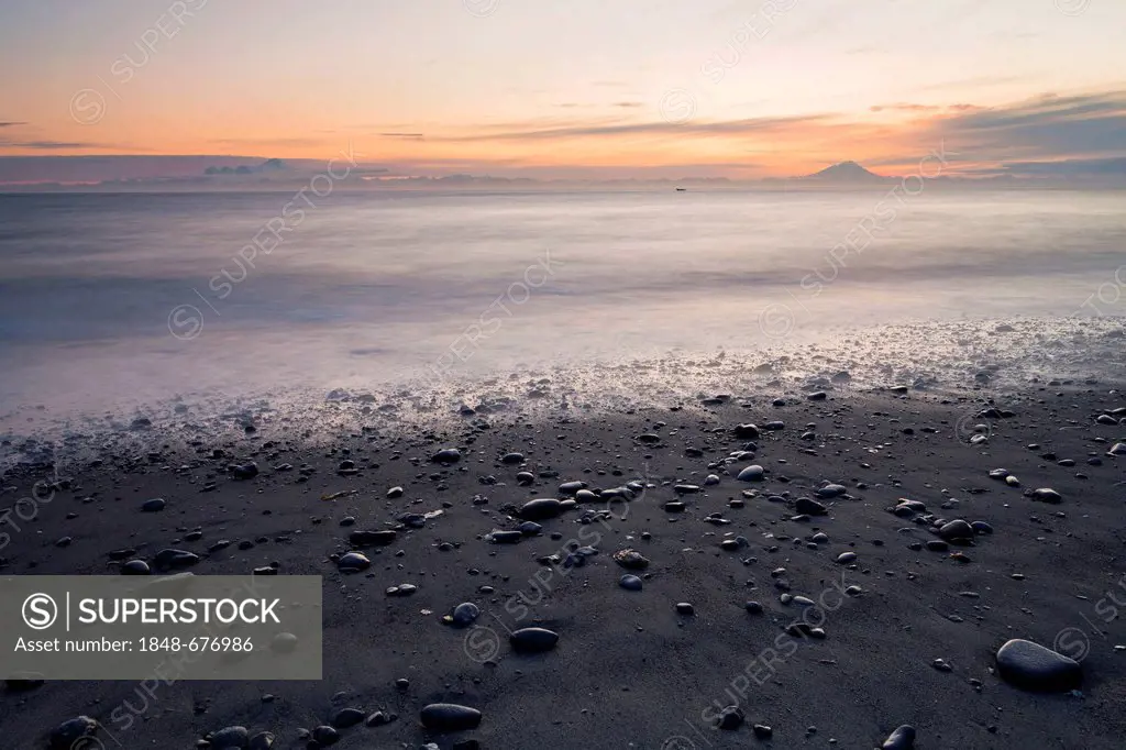 View towards volcanic mountains from the beach at Whiskey Gulch, left, Mount Iliamna, and right, Mount Redoubt, Cook Inlet, Aleutian Range, Alaska, US...