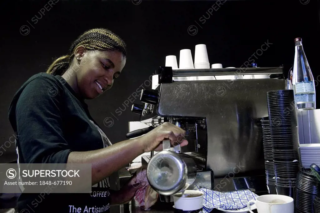 Barista working at a coffee machine in a coffee-house in Cape Town, South Africa, Africa
