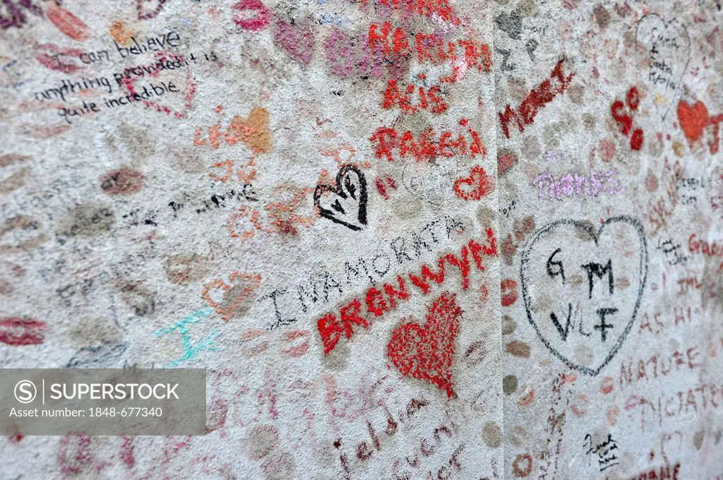Messages and graffiti on the grave stone of Oscar Wilde, Pere Lachaise Cemetery, Paris, France, Europe