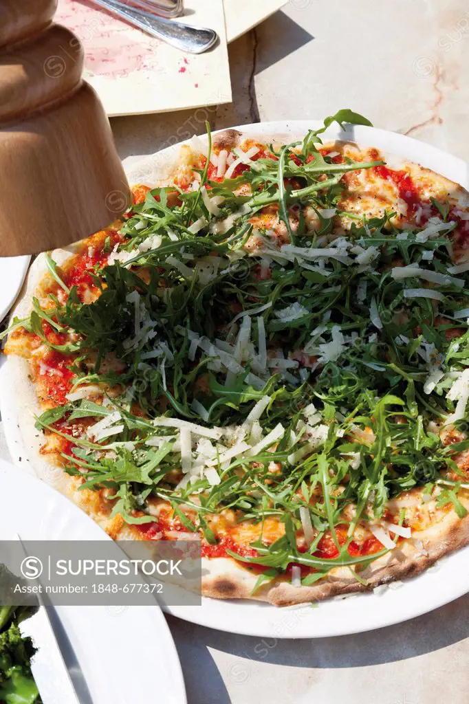 Pizza with rocket or arugula