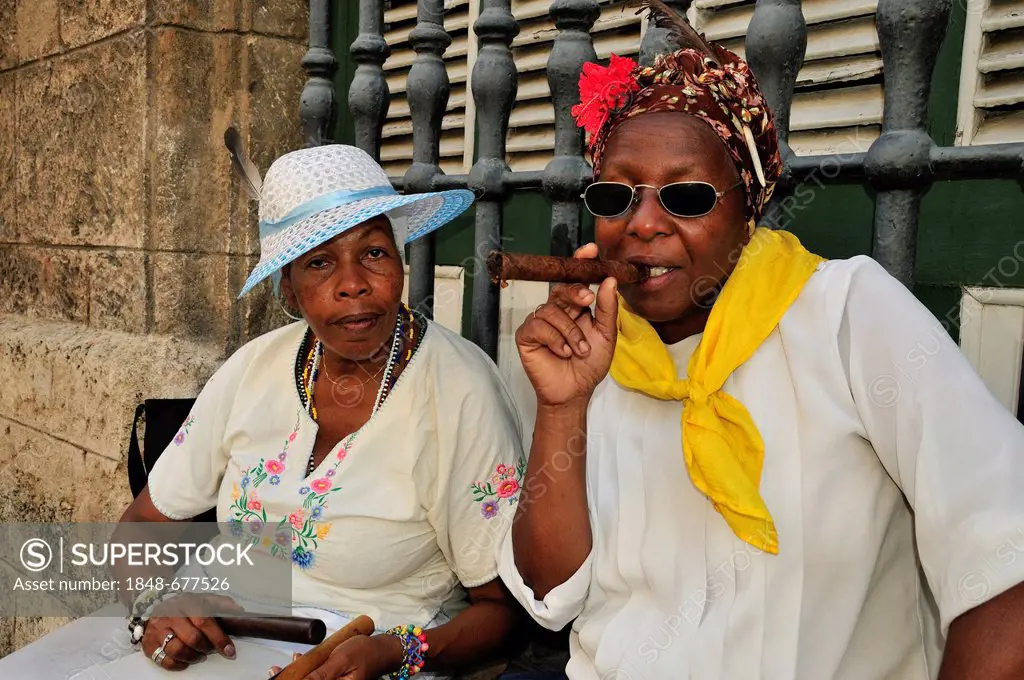 Cuban women with cigars in Old Havana, Habana Vieja, Havana, Cuba, Caribbean