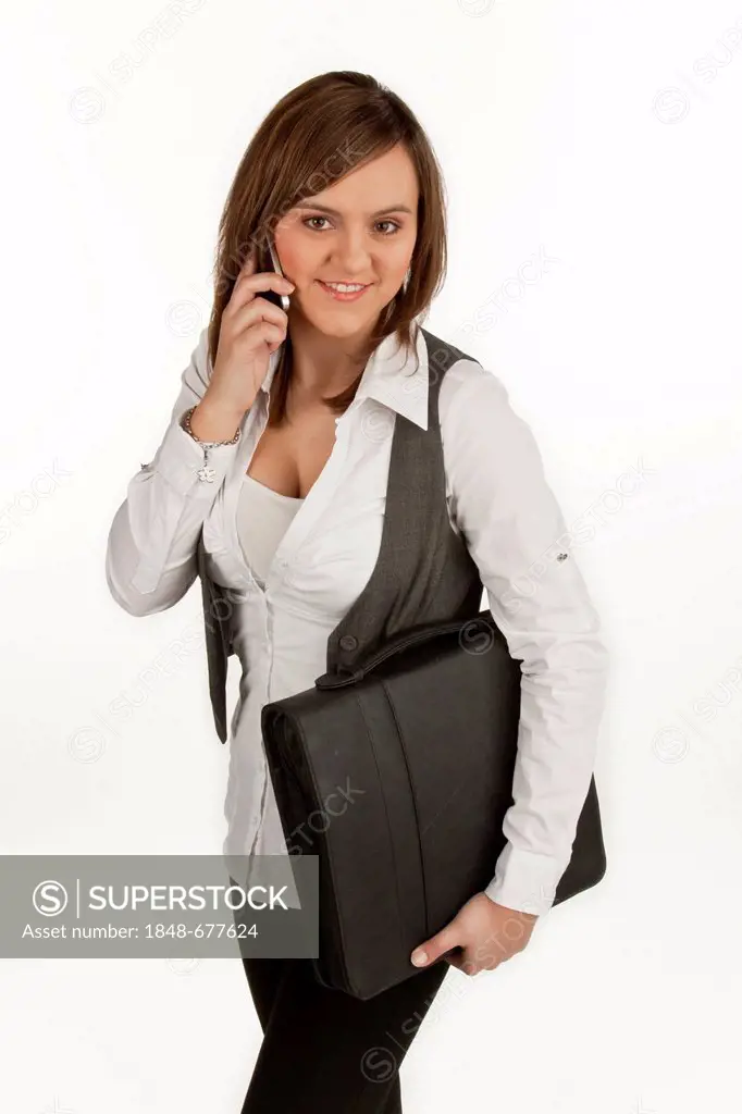 Young woman with a briefcase speaking on her mobile phone