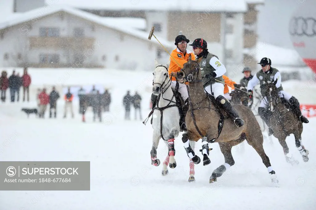 Pedro Fernandez Llorente of team Kitzbuehel on his white horse, left, fighting against Tarquin Southwell of team Hawker Beechcraft, right, polo played...