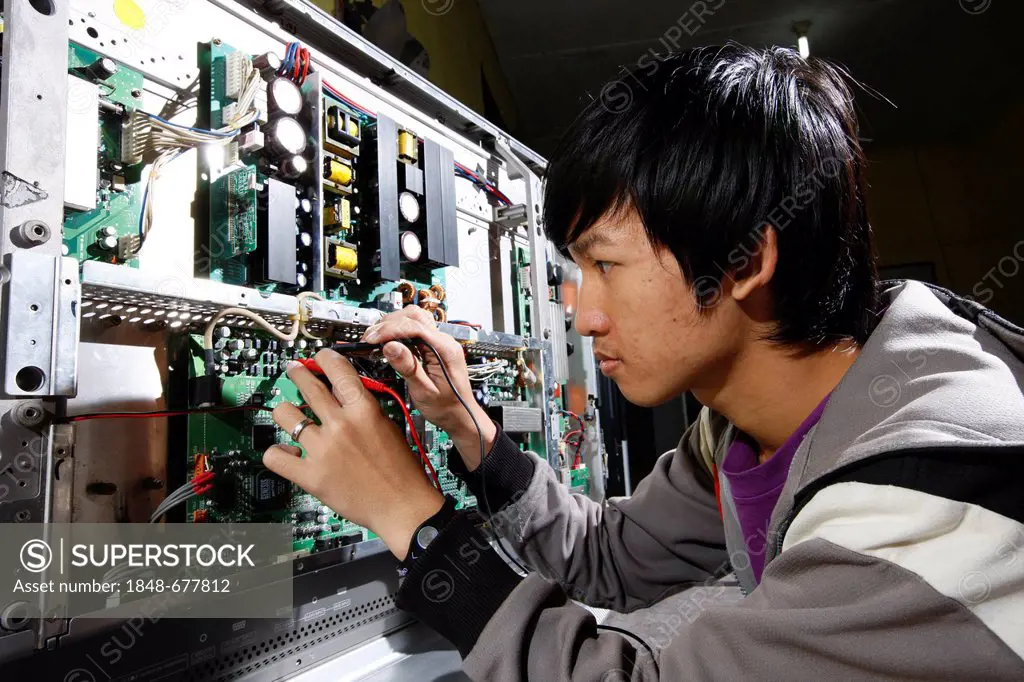 Teenager being trained as electrical engineers, Sukabumi, Bandung, Java, Indonesia, Southeast Asia