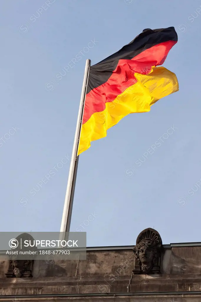 Flag of Germany flying over the Reichstag building, Berlin, Germany, Europe