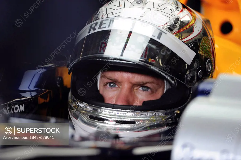Sebastian Vettel, Red Bull Racing, concentrating and wearing a helmet with a new design, Formula 1, Santander German Grand Prix, Nurburgring race trac...