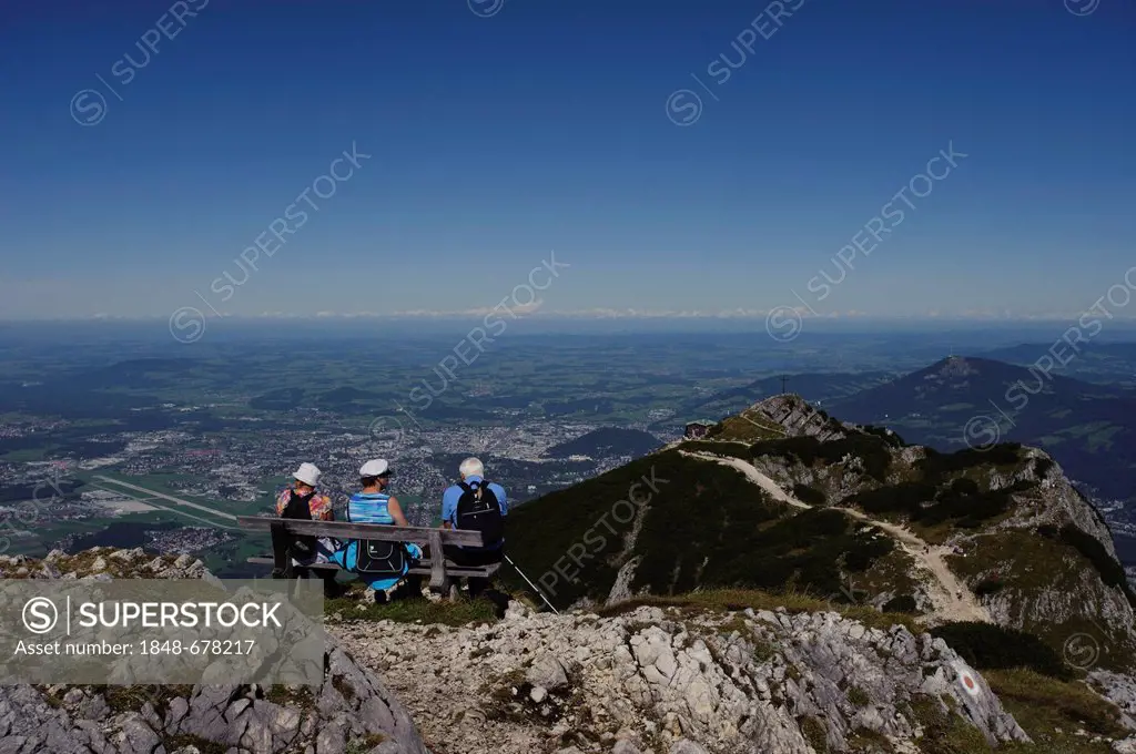 Senior citizens sitting on a bench, enjoying the view from Salzburger Hochthron mountain, Untersberg, Geiereck and Hochalm mountain pasture, Groedig, ...