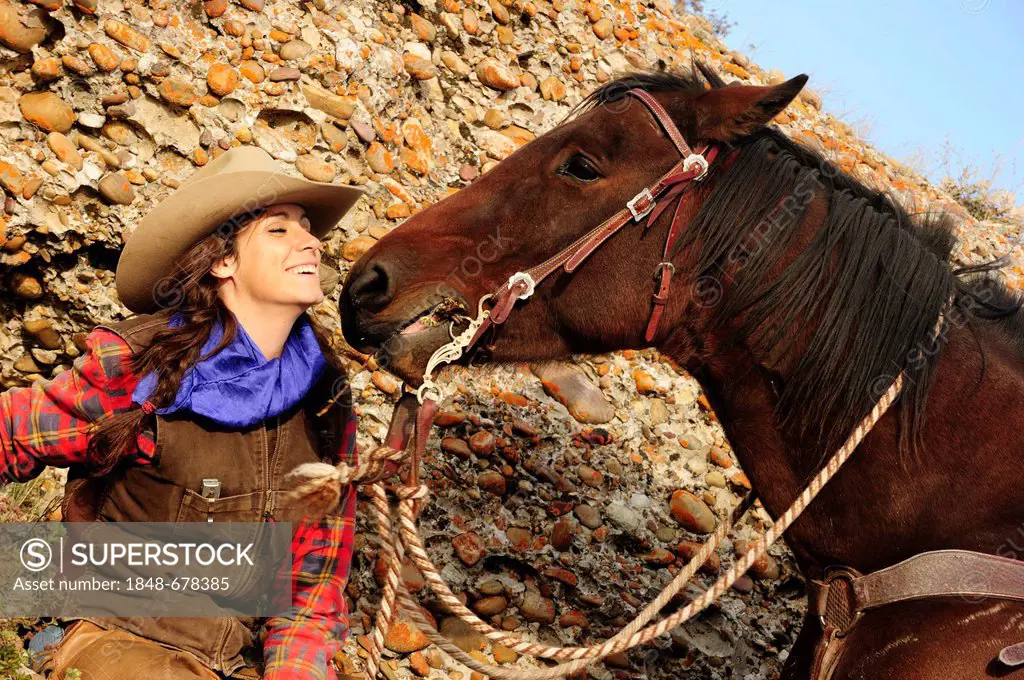 Cowgirl posing with a horse, Saskatchewan, Canada, North America