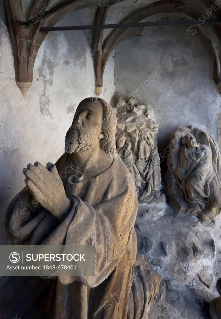 Praying figure at the church of St Bartholomaeus, Volkach, Landkreis Kitzingen county, Lower Franconia, Bavaria, southern Germany, Germany, Europ