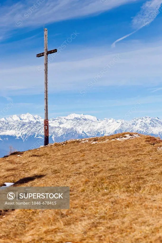 Summit cross on Gantkofel mountain, also known as Mendelkamm mountain, Eppan, mountains near Merano at the back, province of Bolzano-Bozen, Italy, Eur...