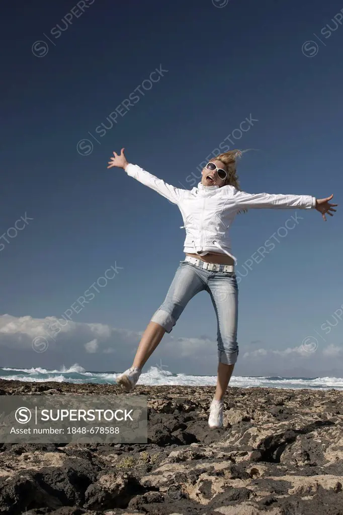Carefree woman on the beach, Playa de Marfolin, Los Lagos Cotillo, Fuerteventura, Spain, Europe