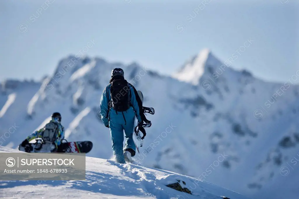 Freeriders, snowboarders walking to the slope, snowy landscape, Alpbach, northern Tyrol, Austria, Europe