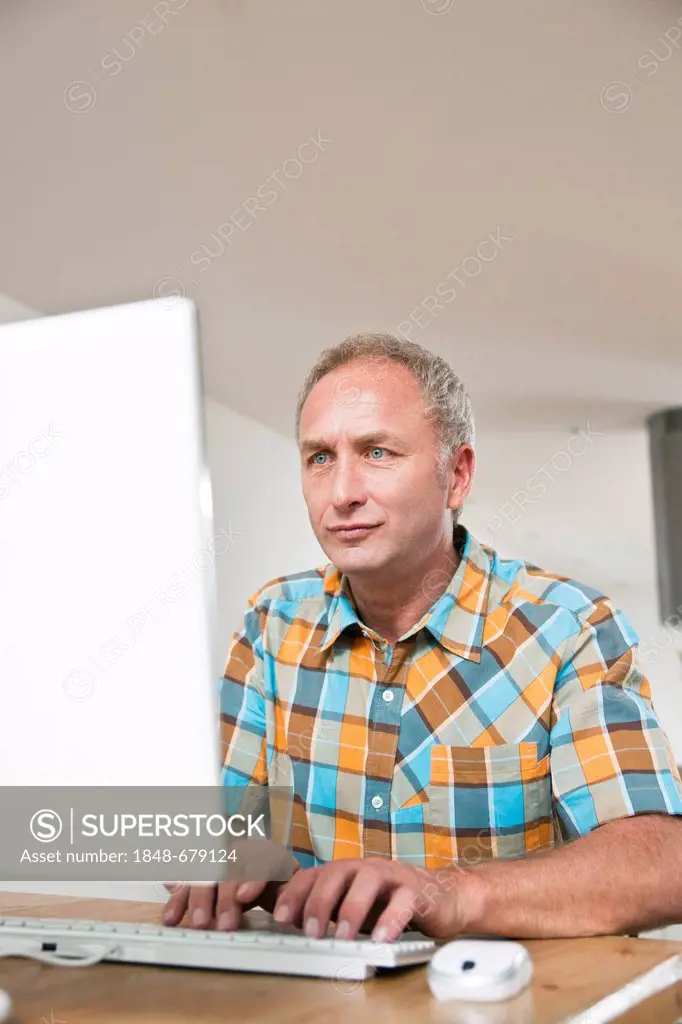 Man sitting in front of a computer